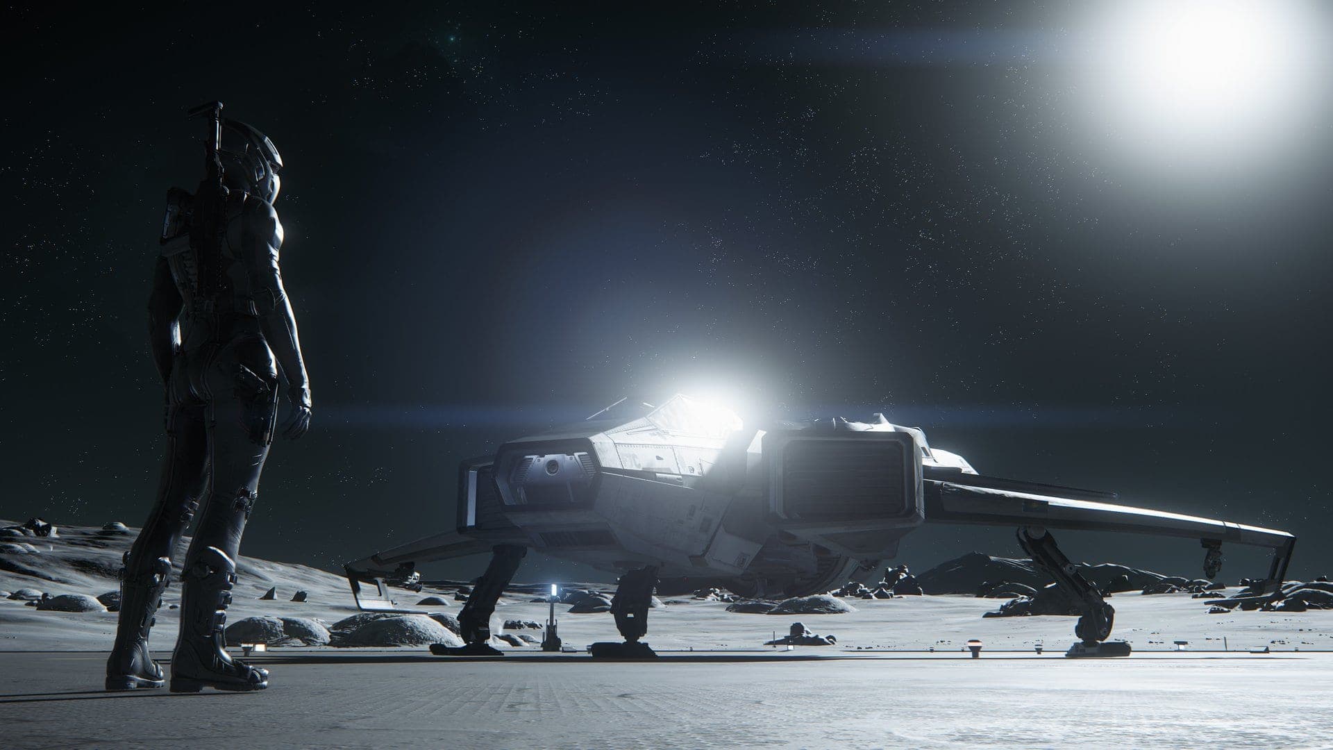 A spacecraft backlit by the sun on a snowy planet surface