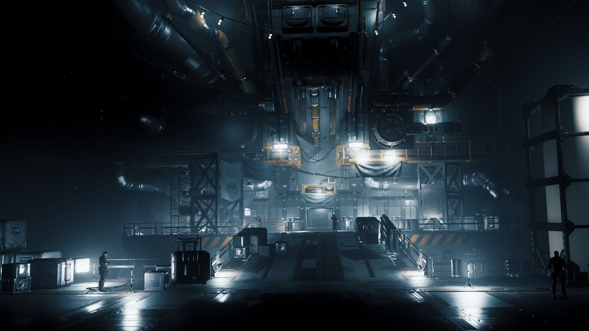 The interior of a capital-ship hangar with docked spacecraft
