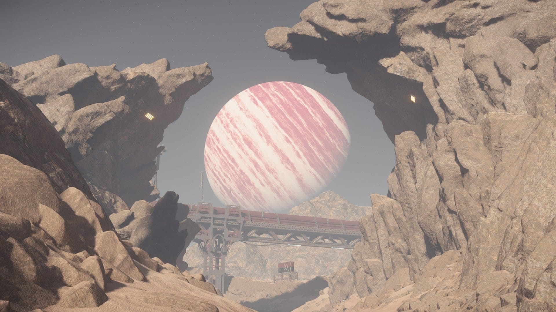 A banded gas giant framed by a rocky canyon arch